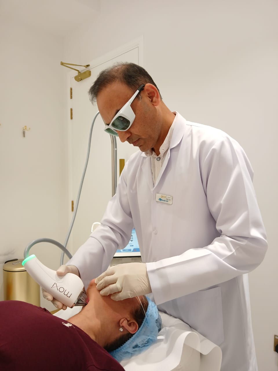 Dr. Zaheer Abbas performing a facial procedure